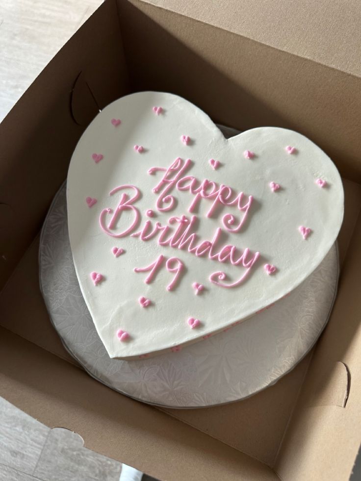 a heart shaped birthday cake in a box