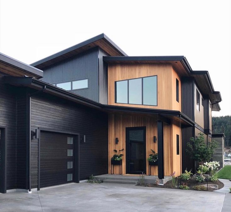 a large house with two garages in front of it and the words price landing written on