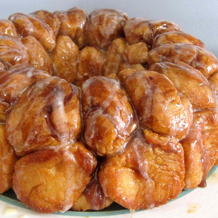 a bundt cake covered in icing sitting on top of a white plate