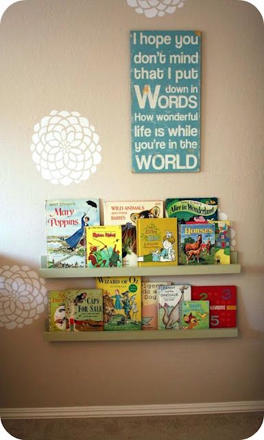 a book shelf with books on it in a child's room or playroom