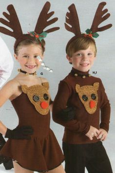 two children wearing reindeer costumes with antlers on their heads and noses, standing next to each other