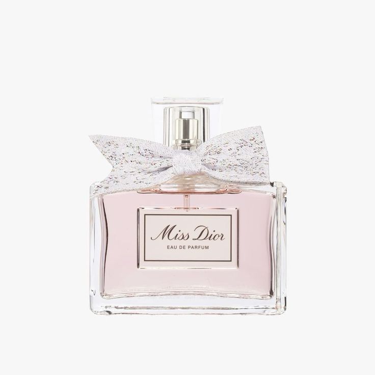 a bottle of perfume with a bow on top