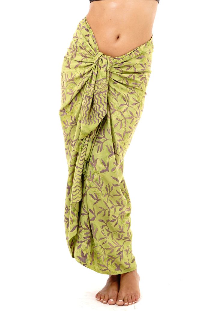 Bamboo print sarong. Perfect to enhance your beach vacation. Wear as a halter dress, headpiece, scarf, or even use as a beach blanket. Don't limit your imagination. Lightweight fabric Bamboo Print Made of soft breathable rayon material Soak in cold water before wearing Hawaiian Printed Sarong For Beach Cover-up, Green Printed Cover-up For Festivals, Printed Tropical Sarong For Swimming, Bohemian Printed Sarong For Beach, Bohemian Printed Beach Sarong, Bohemian Beach Scarf, Green Batik Print Sarong For Beach, Green Tropical Sarong For Pool, Green Hawaiian Sarong For Beach Party