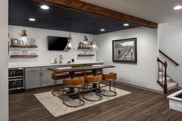 an open concept kitchen and dining room with wood flooring