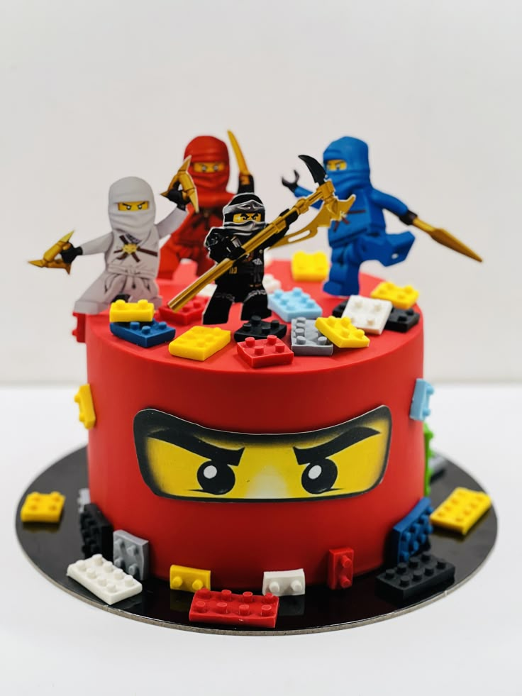 a cake with lego figures on top of it