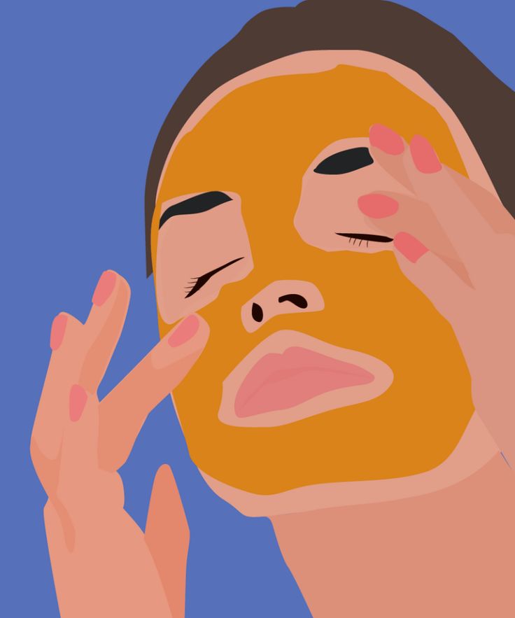 a person with a facial mask on touching their face