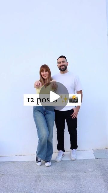 two people standing next to each other in front of a white wall with the words 12 pos written on it