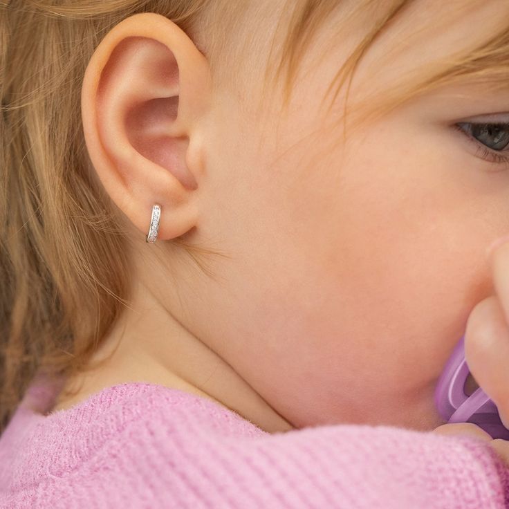 Add some sparkle to your little girls outfits with this beautiful pair of huggie hoop earrings. An extra small pair of huggies that feature beautiful clear cubic zirconia stones throughout the front of the huggie. This fun pair of huggie hoops can be paired with your little one special occasion outfits or can be worn on a regular basis. Created from 14k white gold, these little huggie hoops arrived neatly packaged into a gift box for for easy gifting. White Gold Hoops, Baby Earrings, Kids Necklace, Special Occasion Outfits, Girls Outfits, Huggie Hoop Earrings, Girls Earrings, Gold Hoop, Free Jewelry