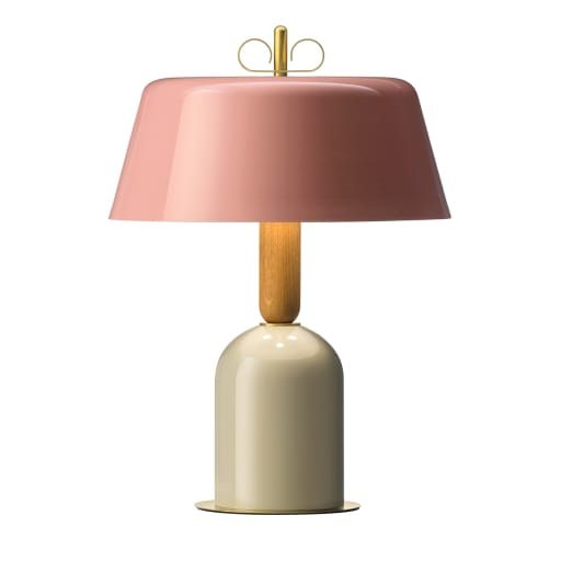 a white table lamp with a pink shade on the base and a wooden stick sticking out of it