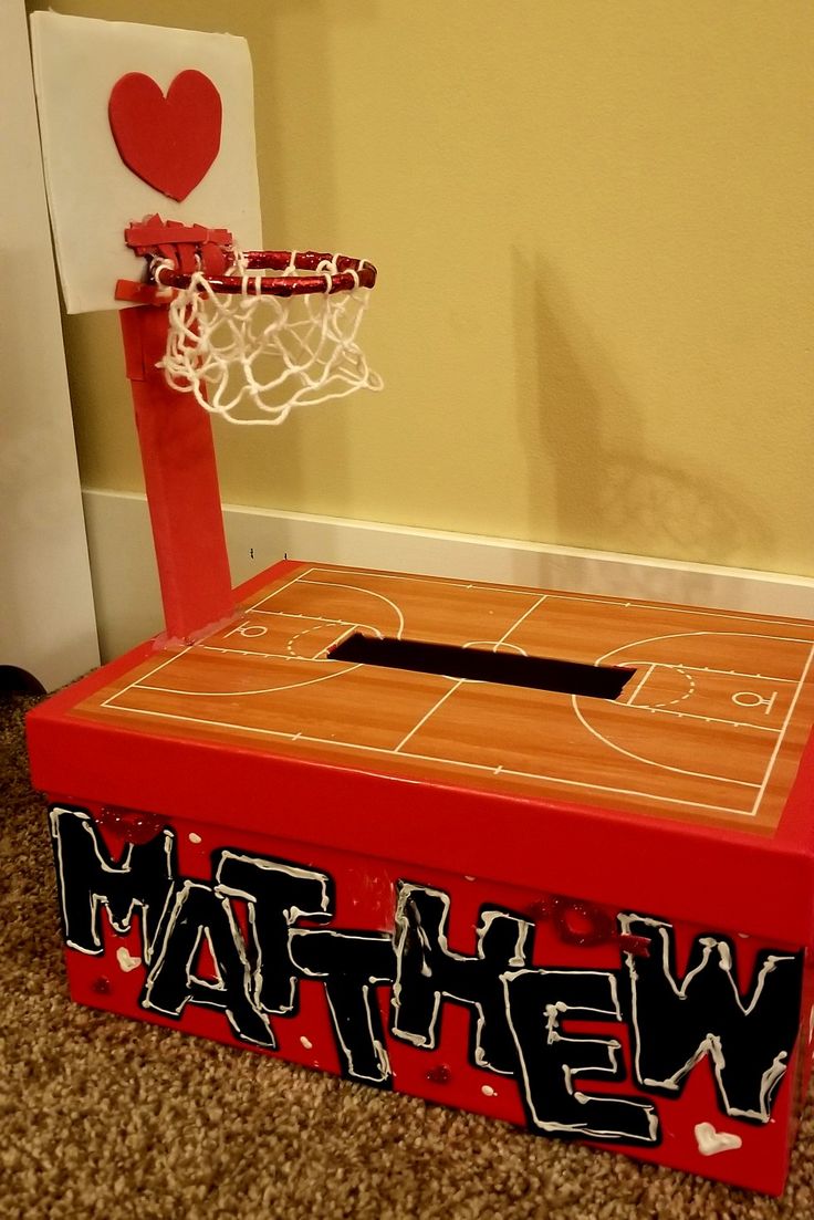 a red box with the word we have written on it and a basketball hoop in front of it