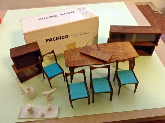 a table and chairs are on display in front of a box that says pacifico