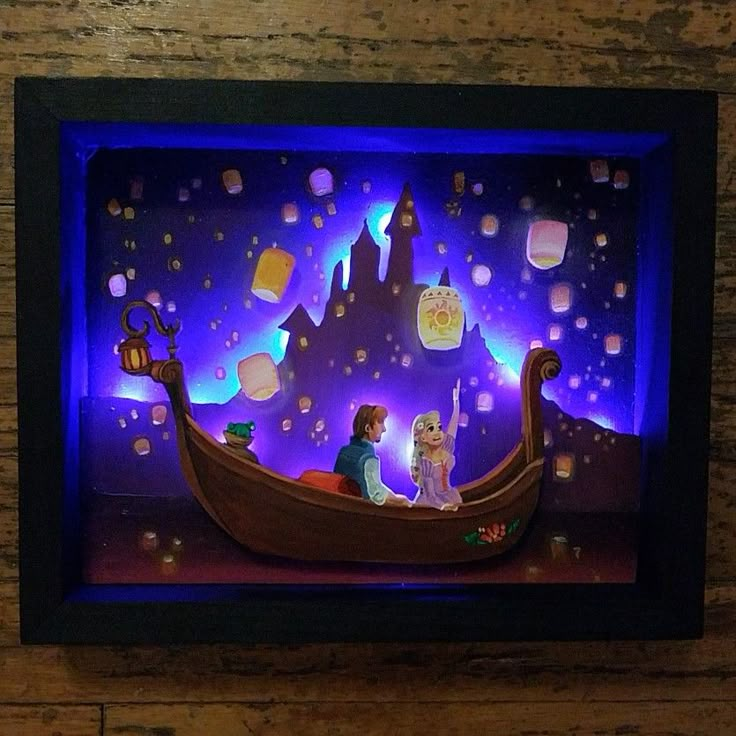 a paper art scene with people on a boat in front of a castle at night