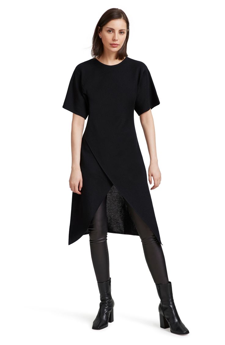 This ultrachic tunic is crafted from fine merino wool and makes a striking silhouette whether worn solo or as part of your modern layered look. Slips on over head Jewel neck Short sleeves High-low hem 100% merino wool Imported Chic Tunic For Spring Layering, Chic Fitted Tops With Side Slits, Fitted Asymmetrical Tunic For Spring, Asymmetrical Spring Tunic For Layering, Chic Fall Tunic For Workwear, Chic Wool Tops For Layering, Elegant Spring Tunic With Asymmetrical Hem, Chic Asymmetrical Hem Tunic For Layering, Chic Fitted Tunic For Fall