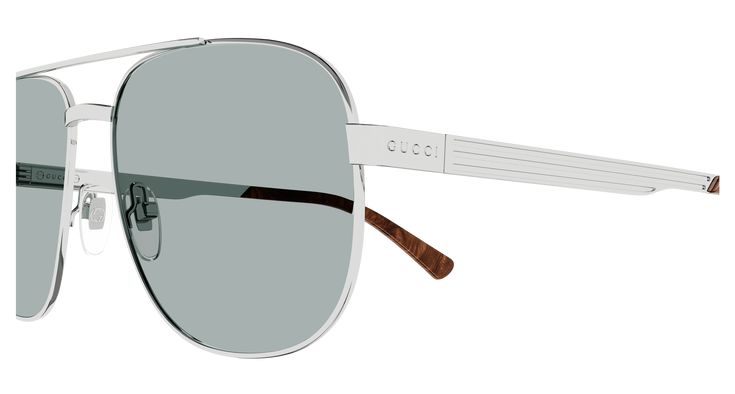 Upgrade your style with the Men's Gucci Logo Silver Green Sunglasses. These sleek sunglasses feature the iconic Gucci logo on the silver frames and a stunning green lens. Made for the modern man, these sunglasses provide both fashion and function with 100% UV protection. Elevate your look and protect your eyes with these designer sunglasses. More Details Packaging: Original case Gucci Collection: Gucci Logo Gender: Man Frame color: Silver Lens color: Green Frame material: Metal Lens material: Ny Classic Gucci Shield Sunglasses For Summer, Classic Silver Shield Sunglasses With Uva Protection, Classic Silver Shield Sunglasses With Uv Protection, Classic Gucci Sunglasses With Mirrored Lenses, Classic Gucci Aviator Sunglasses For Summer, Classic Gucci Shield Sunglasses With Polarized Lenses, Gucci Classic Shield Sunglasses With Polarized Lenses, Elegant Gucci Aviator Sunglasses With Polarized Lenses, Sleek Gucci Sunglasses For Summer