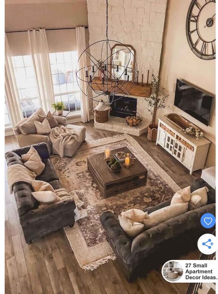 a living room filled with furniture and a fire place