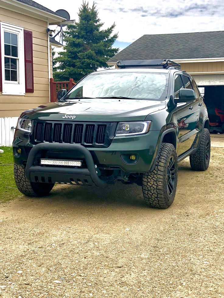 a jeep parked in front of a house