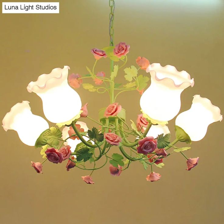 a chandelier with flowers hanging from it