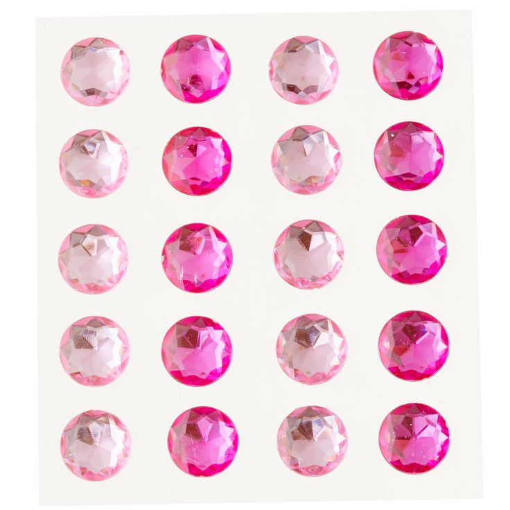 many different types of pink stones on a white background