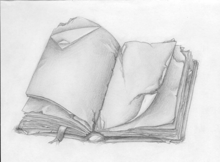 an open book sitting on top of a white tablecloth covered floor next to a pen and ink drawing