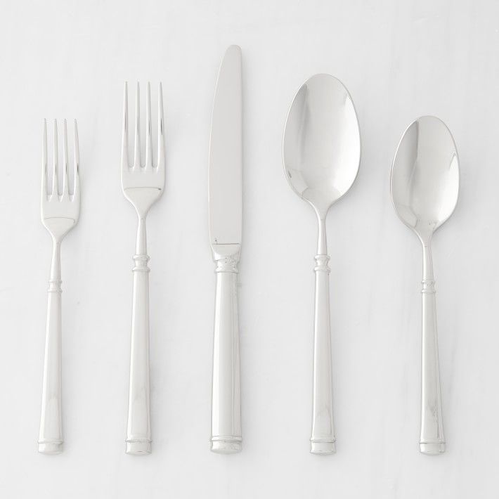 five forks, two spoons and one knife on a white surface