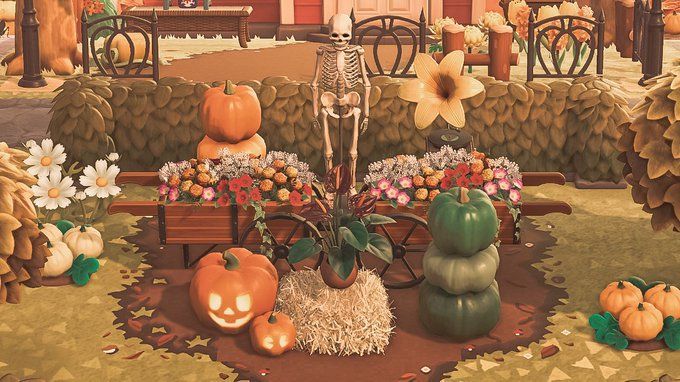 a painting of pumpkins and flowers in front of a building with a skeleton on it