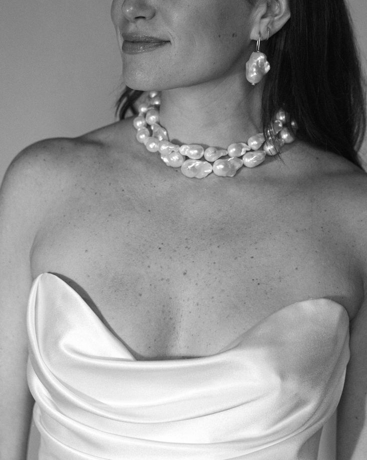 Shop our extra large white baroque freshwater pearl beaded necklace. Make a statement in this timeless twist on the classic pearl necklace. See the last photo to compare sizes between the Classic and Chunky Baroque Pearl Necklaces. Details: - Gold plated silver - Length: 15", Extender 3" - Pearls are natural; variations occur per necklace - Pearl direction varies Party Pearl Necklace With Baroque Pearl Pendant, Party Jewelry In Pearl White Baroque Pearl, Party Jewelry In Pearl White With Baroque Pearls, White Baroque Pearl Necklace For Party, Party Jewelry With Baroque Pearls In Pearl White, Classic Baroque Pearl Jewelry For Party, Classic Party Jewelry With Baroque Pearl, Party Baroque Pearl Jewelry In Pearl White, Baroque Pearl Necklace With Pearl Charm For Party