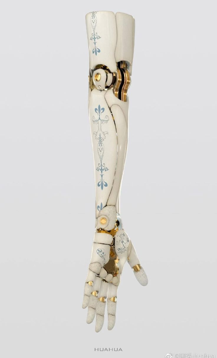 an artificial hand is holding something in it's right hand, with gold accents