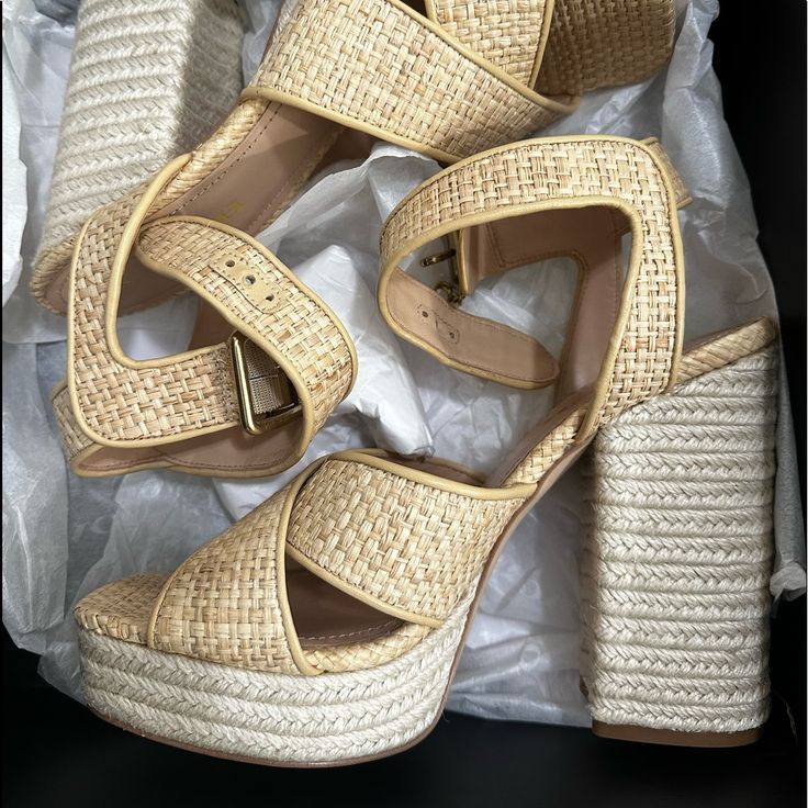 Make A Fabulous Statement By Donning The Gorgeous And Comfortable Design Of The Coach Nelly Raffia Sandals. Measurements: Heel Height: 5 In Weight: 1 Lb 1 Oz Platform Height: 1 12 In Beige Straw High Heels, Natural Color Open Toe Platform Heels, Beige Heels For Summer Vacation, Chic Natural Color Synthetic Heels, Beige Platform Sandals With Straw Material, High Heel Sandals With Removable Insole In Natural Color, Natural Color Platform Sandals With Ankle Strap, Beige Straw Platform Sandals, Natural High Heel Sandals With Removable Insole