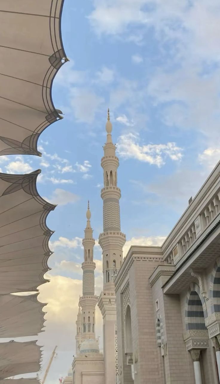 a large white building with a tall tower