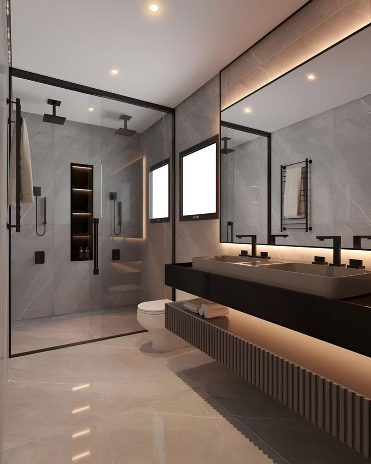 a modern bathroom with two sinks and mirrors