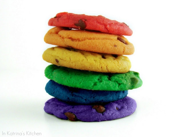 a stack of colorful cookies sitting on top of each other