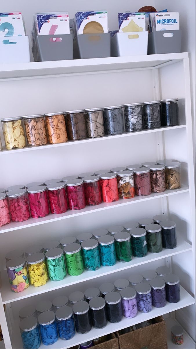 the shelves are filled with many different types of thread