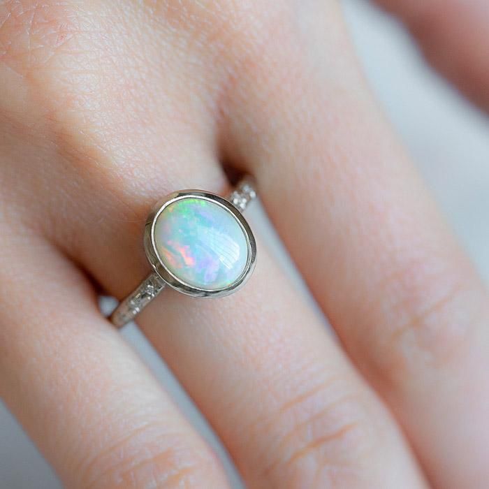 Our Twilight Ring has been set with a crystal opal and G/VS diamonds star set into the band. Opals are the birthstone of October. Opal measures 9 x 7mm. Total diamond weight 0.03ct. Band width 2.2mm. Pictured here with a high shine finish. For a matte finish please leave a note at checkout. Please note, we will match the opal as close to the image as possible. Each opal is unique and may vary in appearance and colour from what is depicted on the site. Twilight Ring, Crystal Opal, Vs Diamond, Diamond Star, The Band, October Birth Stone, Caicos Islands, Pitcairn Islands, Tanzania