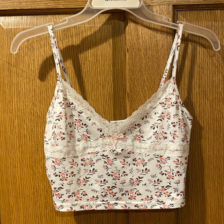 Colorful Natalie Lace Trim Cropped Babydoll Tank Top Size Small But Fits More Like An Xs In My Opinion And Is Pretty Cropped Brand New With Tags, Only Tried On! Cute White Tank Top With Floral Print, Cute Cotton Camisole For Spring, Casual Pink Floral Print Camisole, Pink Cotton Cami Top, Pink Cotton Camisole With Floral Print, White Floral Print Camisole Crop Top, Pink Cotton Camisole Top, Pink Summer Tops With Lace Trim, Pink Floral Print Cotton Camisole