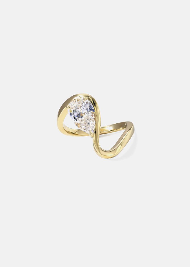 - The Trace Collection The Diamond Trace Ring is crafted of polished 18 karat gold, showcasing a fluid line of gold that delicately dances around the finger with a floating 1.2ct pear cut diamond. 1.2ct G color, VS2 clarity diamond (GIA certified) Quarter sizes are available upon request. Please make a note at checkout. Custom variations can be made with alternative stone sizes. For inquiries: bespoke@katkimfinejewelry.com Available in Yellow Gold, White Gold, Rose Gold — Platinum upon request. Gold Pear-shaped Diamond Ring, Gold Pear-shaped Diamond Ring With Single Diamond, Gold Teardrop Diamond Ring With Rose Cut, Fine Jewelry 14k Gold Pear-shaped Diamond Ring, Gold Teardrop Rose Cut Diamond Ring, Gold Teardrop Ring With Single Diamond, Gold Diamond Ring With Rose Cut Teardrop Diamonds, Modern Twist Yellow Gold Ring With Single Diamond, Gold Pear-shaped Single Diamond Ring