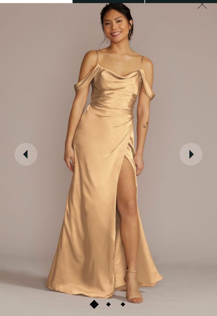 a woman in a gold dress with one leg slited up and the other side split open