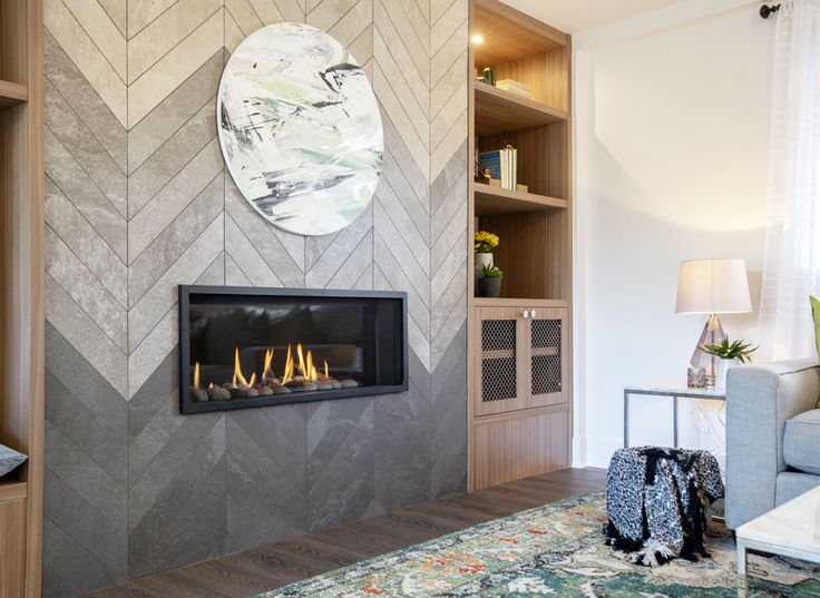 a living room with a fire place in the center and a large mirror on the wall