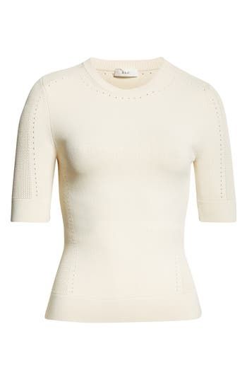 Intricate pointelle stitching defines the sleeves, neckline and sides of this ultrasoft top. Crewneck Short sleeves 63% viscose, 36% nylon, 1% elastane Dry clean Imported Elegant Stretch Pointelle Knit Top, Cream Fine Knit Crew Neck Top, Elegant Stretch Pointelle Knit Sweater, Elegant Fitted Beige Knit Top, Elegant Pointelle Knit Tops For Fall, Elegant Pointelle Knit Fall Tops, Fitted Textured Knit Beige Tops, Fitted Pointelle Knit Sweater For Layering, Elegant Fitted Pointelle Knit Top