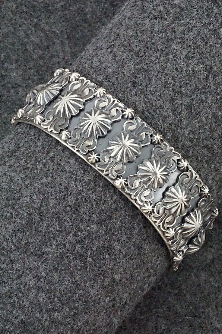 This sterling silver bracelet was made by Navajo silversmith Bobby Platero. The inside is signed RB and stamped .925.Size: 5 3/4" (will fit up to a 6 7/8" wrist)Gap: 1 1/8"Length: 3/4"Free shipping on all orders! We ship with USPS and always include tracking. All orders ship within a day of payment.Returns are accepted up to 30 days after you receive your order. Just send us a message. Our shop offers cash back or store credit. The item must be returned in new condition. Southwestern Sterling Silver Hallmarked Jewelry, Southwestern Nickel-free Bangle Jewelry, Sterling Silver Cuff Bracelet Native American, Nickel-free Southwestern Bangle Cuff Bracelet, Nickel-free Southwestern Sterling Silver Bracelet, Sterling Silver Bracelet, Native American Jewelry, Free Jewelry, Sterling Silver Bracelets