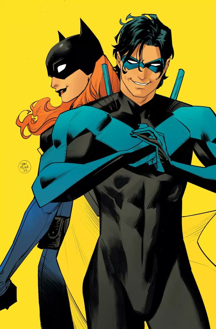 the batman and catwoman are hugging each other