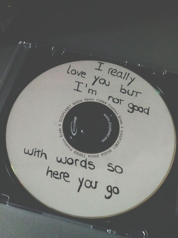 a cd with words written on it in black and white ink that reads, i really love you but i'm not god