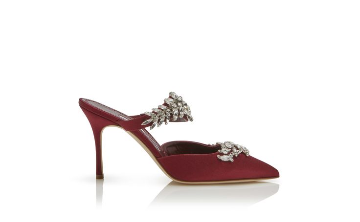 LURUM | Burgundy Satin Crystal Embellished Mules | Manolo Blahnik Luxury Rhinestone Mules For Formal Occasions, Luxury Embellished Evening Mules, Luxury Embellished Mules For Evening, Luxury Embellished Mules For Party, Glamorous Embellished Evening Mules, Glamorous Embellished Mules For Evening, Elegant High Heel Mules For Gala, Elegant Evening Mules With Ankle Strap, Elegant Ankle Strap Mules For Evening