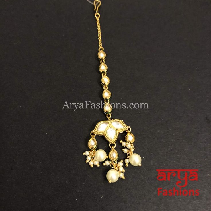 Russhi Small Kundan Pearl Mang Tika for Girls Adjustable Kundan Tikka, Adjustable Tikka For Festive Occasions, Adjustable Kundan Necklace With Tilla For Festivals, Gold Temple Jewelry Tikka As Gift, Gold Tikka For Navratri Gift, Adjustable Stone Work Tikka For Diwali, Festive Adjustable Tikka For Puja, Adjustable Tikka For Festivals, Gift Tikka With Cutdana