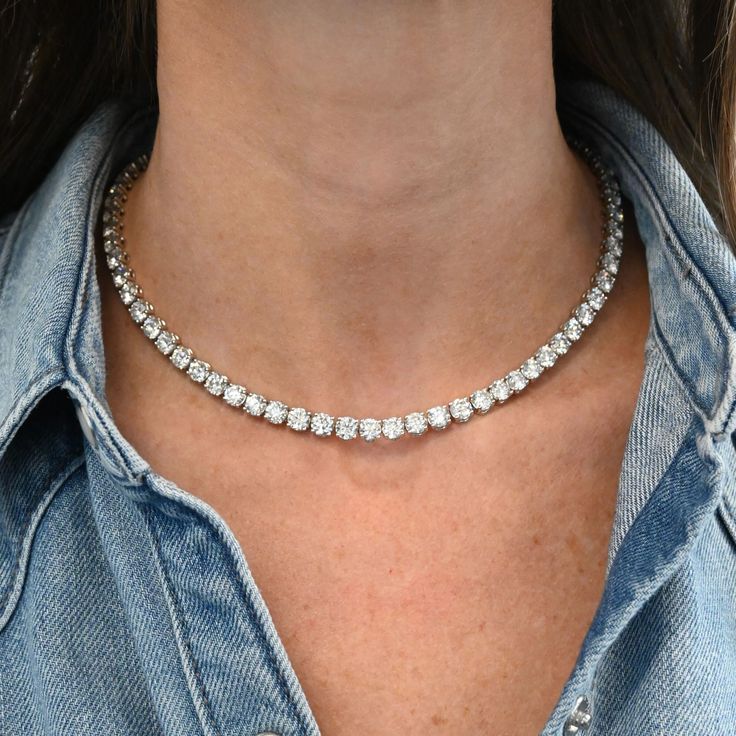 This 35 Carat Diamond Tennis Necklace exudes luxury, sophistication, and timeless beauty featuring 70 round diamonds. While undeniably luxurious, this necklace is versatile enough to complement a variety of ensembles. Available in 18K White Gold Diamond weight = 35.04 carats Diamond quality = GH, SI1-SI2 Luxury Round Diamond Jewelry, Luxury White Gold Rounded Jewelry, Luxury Round Tennis Necklace As Gift, Timeless Luxury Tennis Necklace For Engagement, Luxury Round Tennis Necklace, Luxury Classic Jewelry With Baguette Diamonds, Luxury Spiral White Gold Jewelry, Luxury Vvs Clarity Diamond Necklace, Luxury Timeless White Gold Jewelry