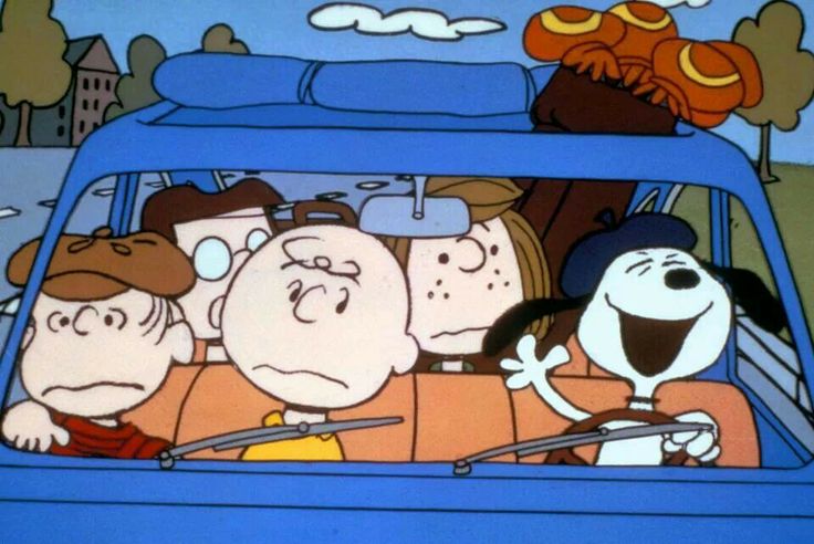 the peanuts gang is driving in their car