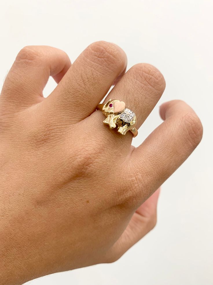 -14k Elephant Ring  -100% Gold  -Size 7  - Tricolored Gold  -Cubic zirconia  -Item  sold by piece. Weight undetermined. Yellow Gold Cubic Zirconia Couple Rings As Gift, Yellow Gold Multi-stone Diamond Rings, Heirloom Multi-stone Cubic Zirconia Rings, Rose Gold Multi-stone Cubic Zirconia Ring, Gold Diamond Multi-stone Ring, 14k Gold Multi-stone Ring, Gold Multi-stone Diamond Promise Ring, Gold Cubic Zirconia Three Stone Ring, Yellow Gold Multi-stone Promise Ring