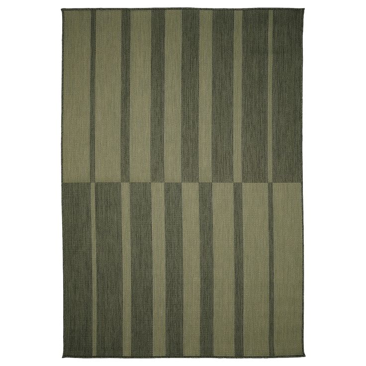 a green rug with vertical stripes on it