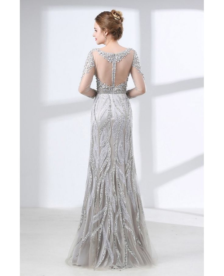 the back of a woman's dress in silver