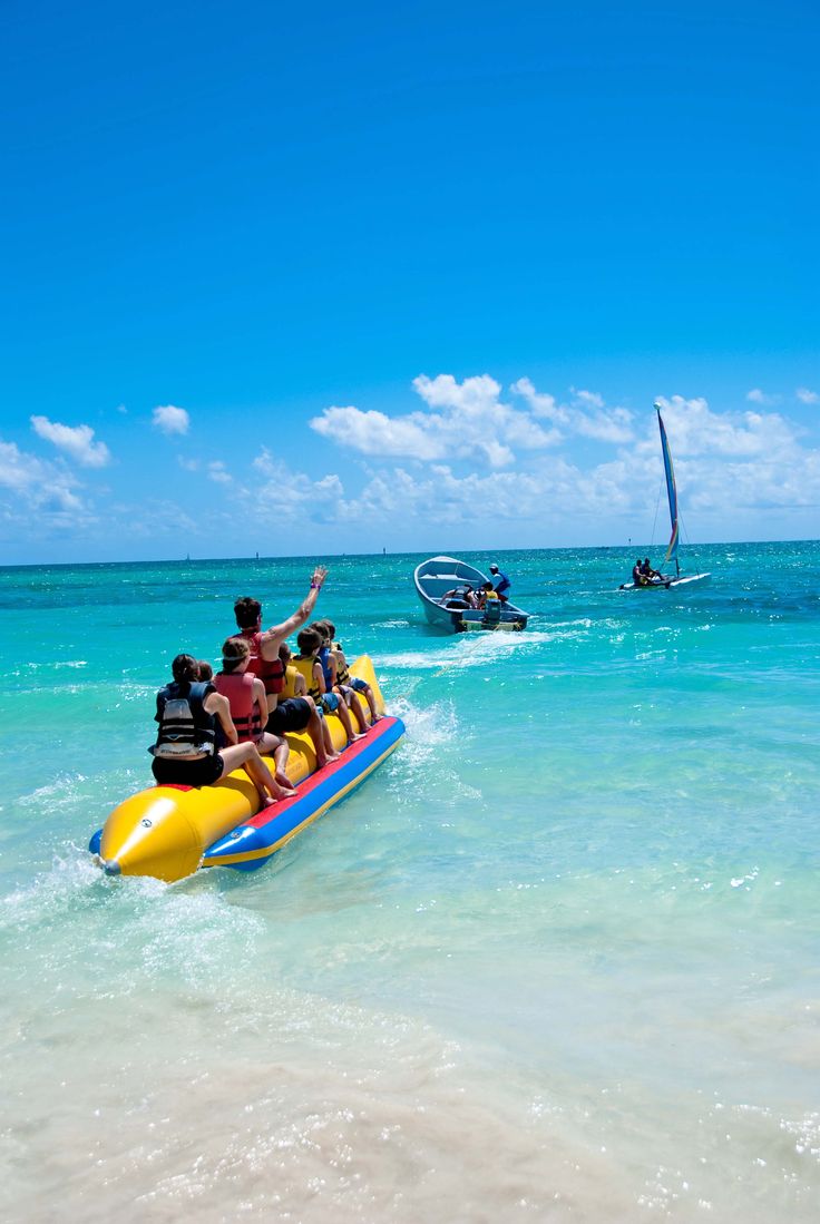 several people are riding on a boat in the ocean