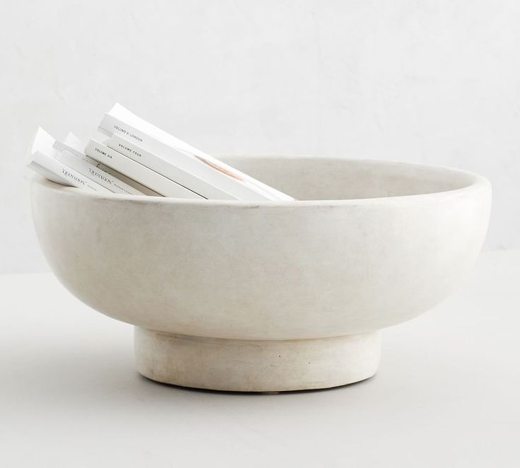 a bowl that has some papers in it